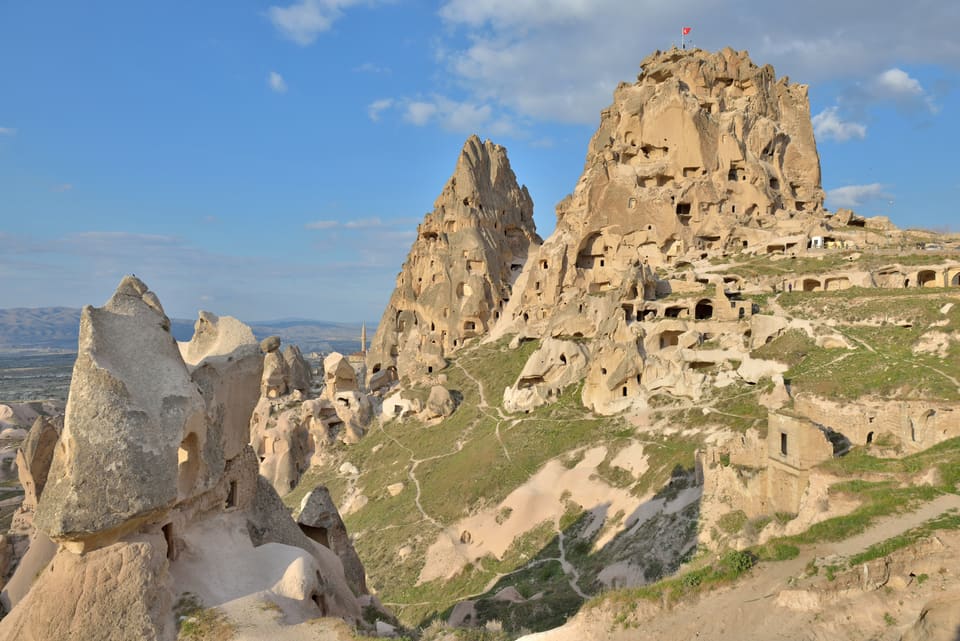 Uçhisar Castle, a tall rock outcrop riddled with cave rooms above the village